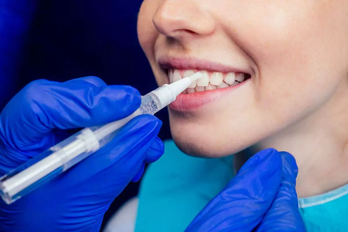 Dentist works on tooth crown